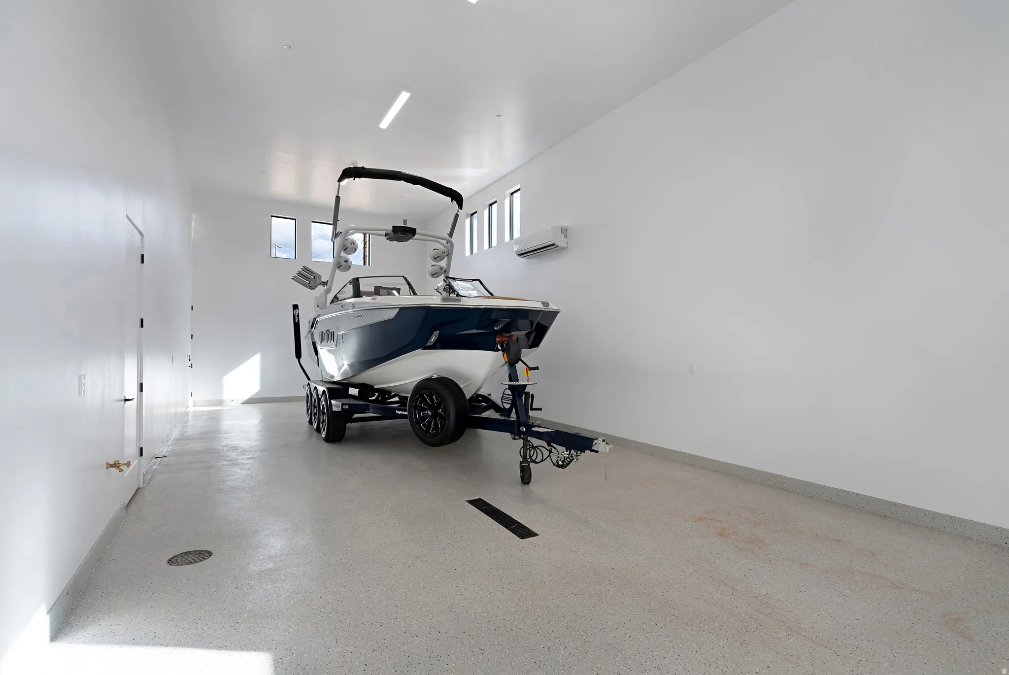 Workout area featuring a garage and baseboards
