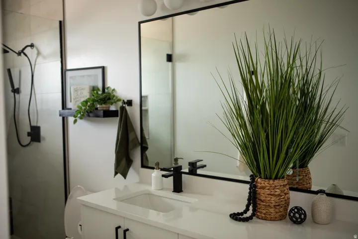 Bathroom featuring vanity and a shower stall