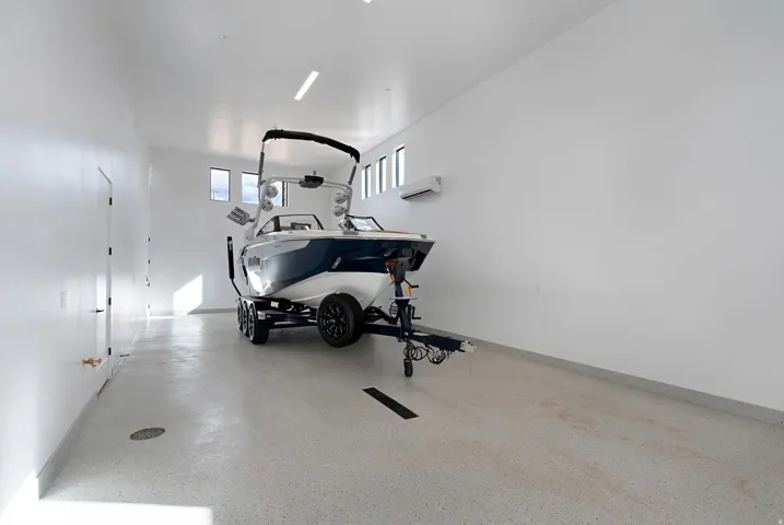 Workout area featuring a garage and baseboards