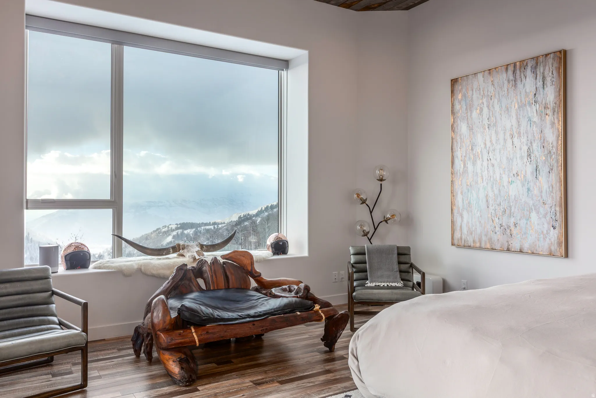Bedroom featuring multiple windows and wood finished floors