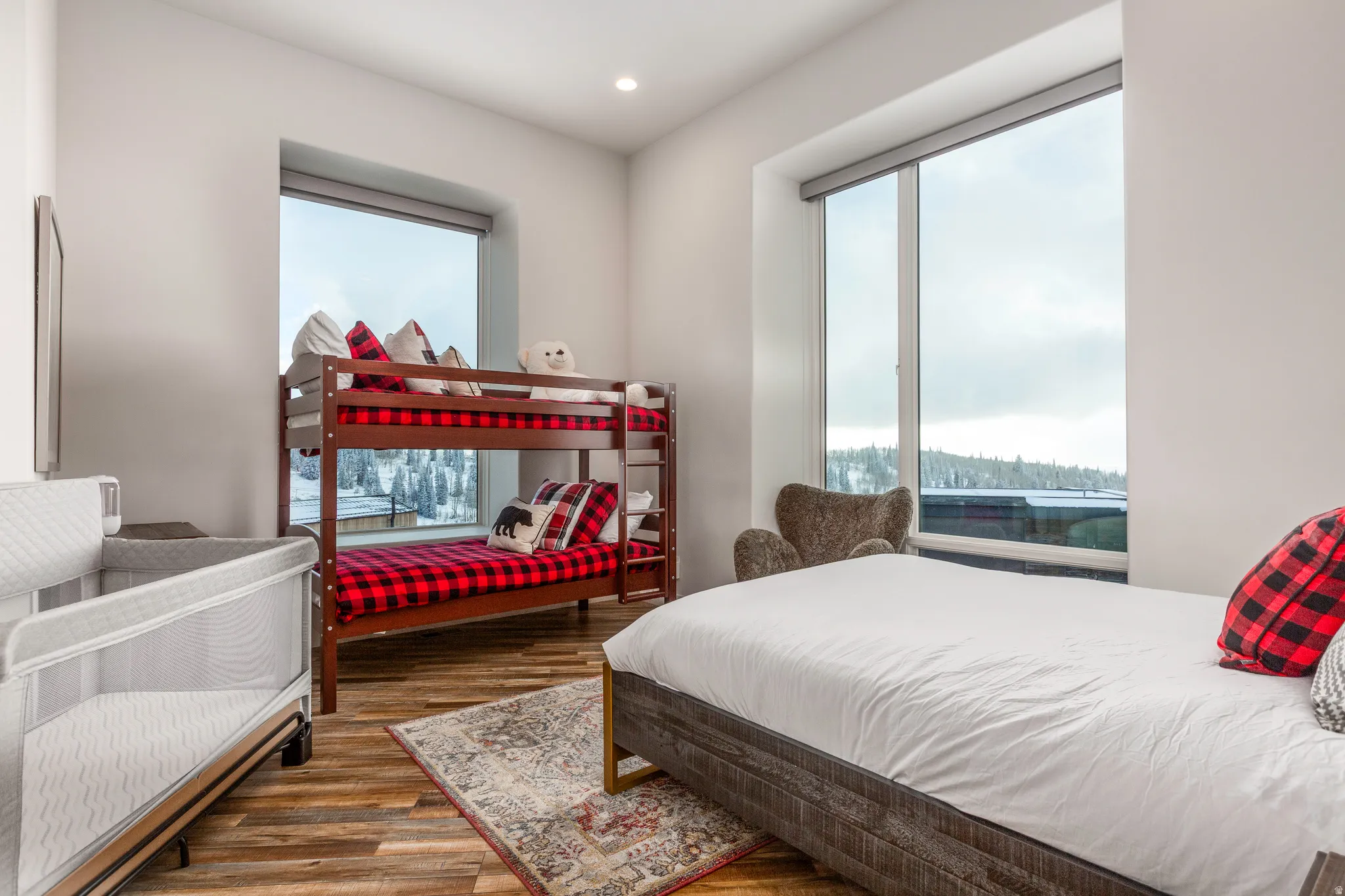 Bedroom featuring dark wood-type flooring, multiple windows, and recessed lighting