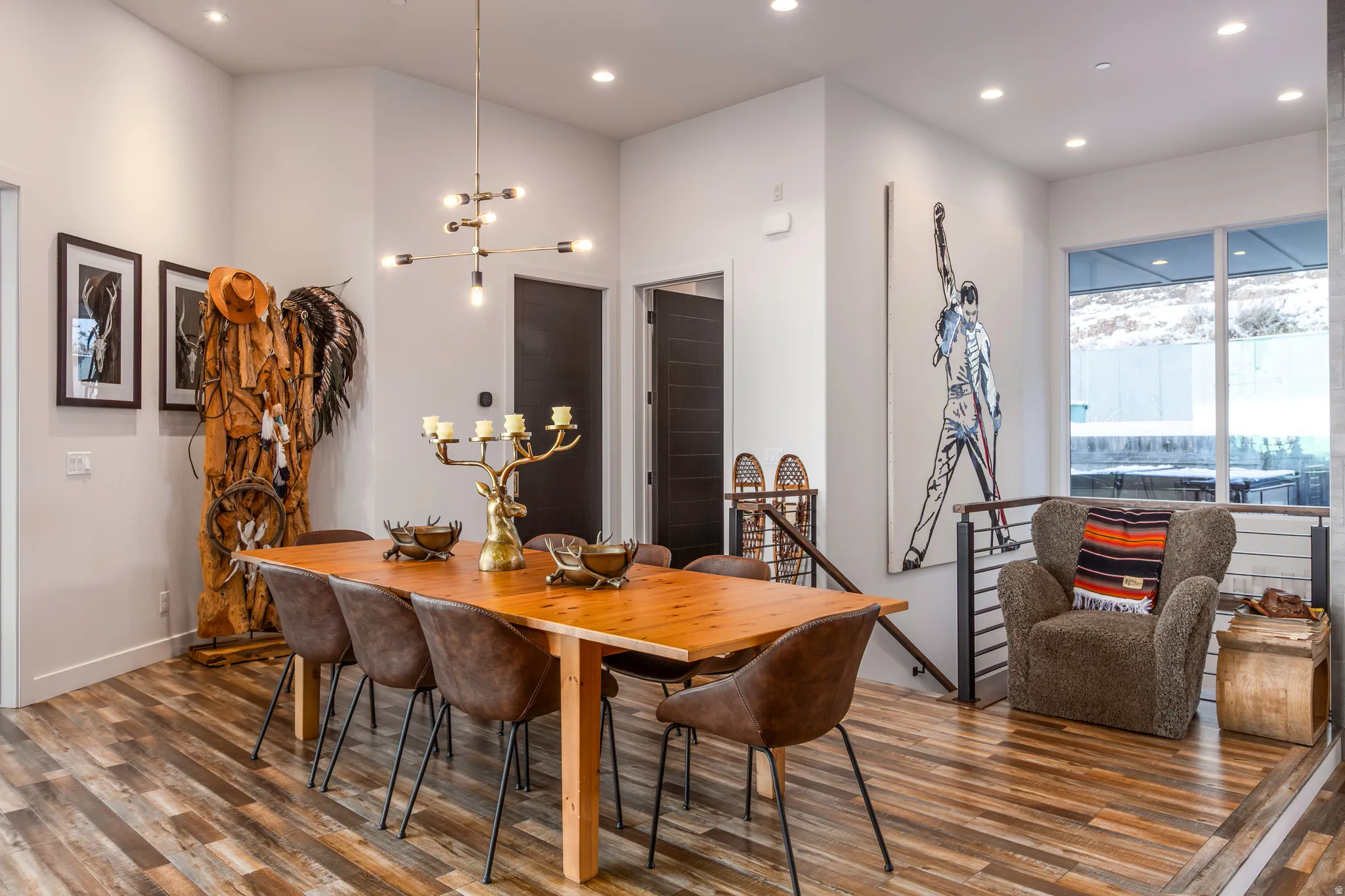 Dining space with wood finished floors, a chandelier, and recessed lighting