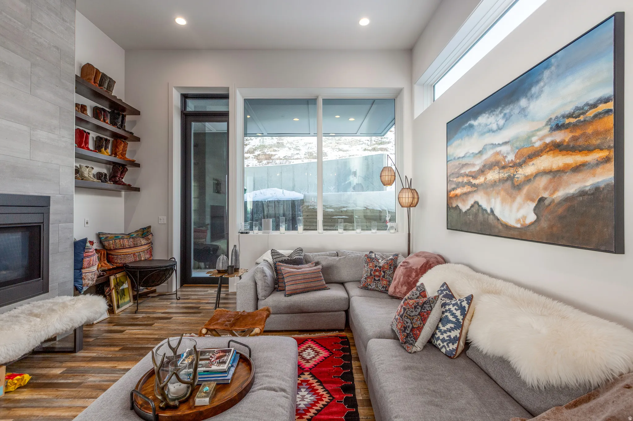 Living area with a fireplace and wood finished floors