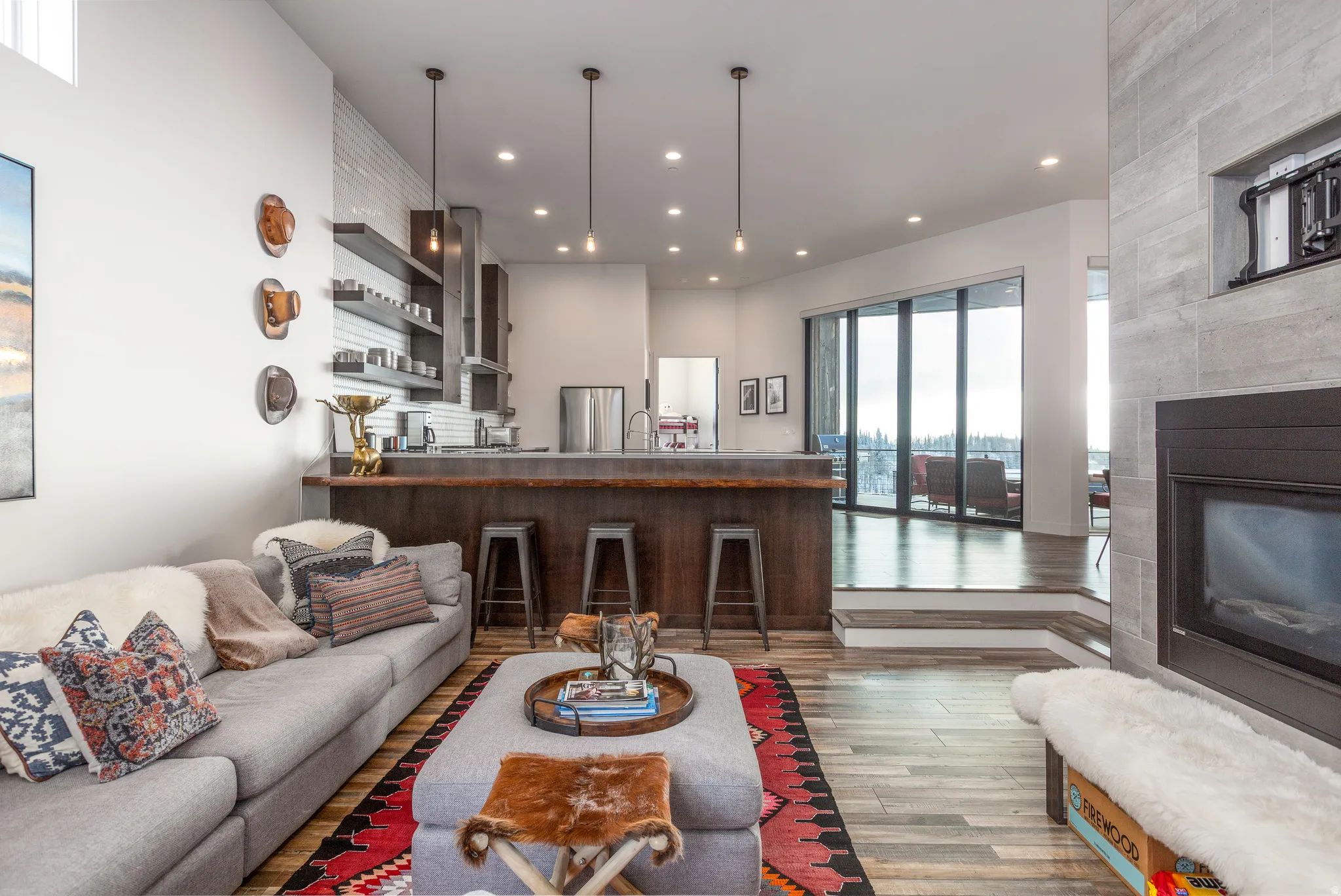 Living area with wood finished floors, recessed lighting, and a fireplace