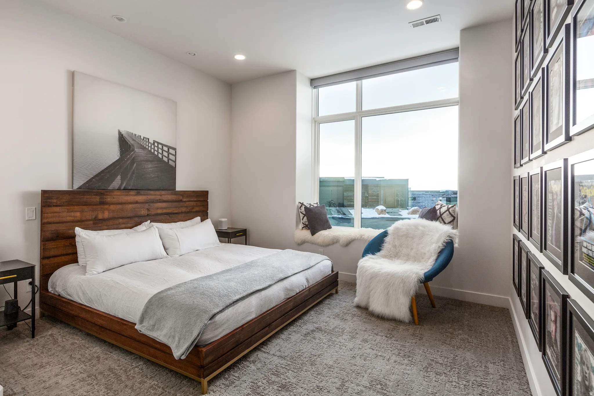 Bedroom with carpet, recessed lighting, and floor to ceiling windows