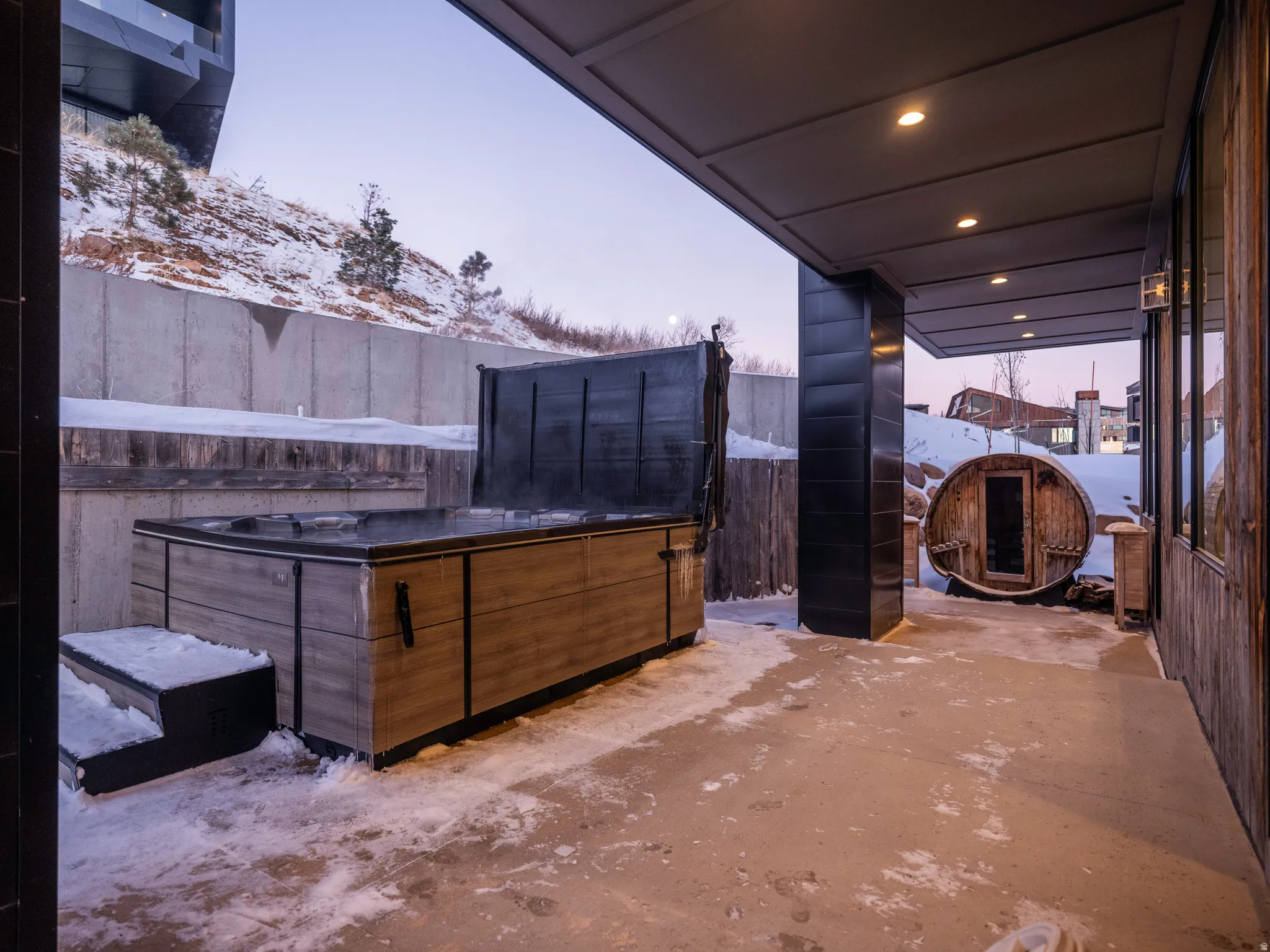 Snow covered patio featuring a patio