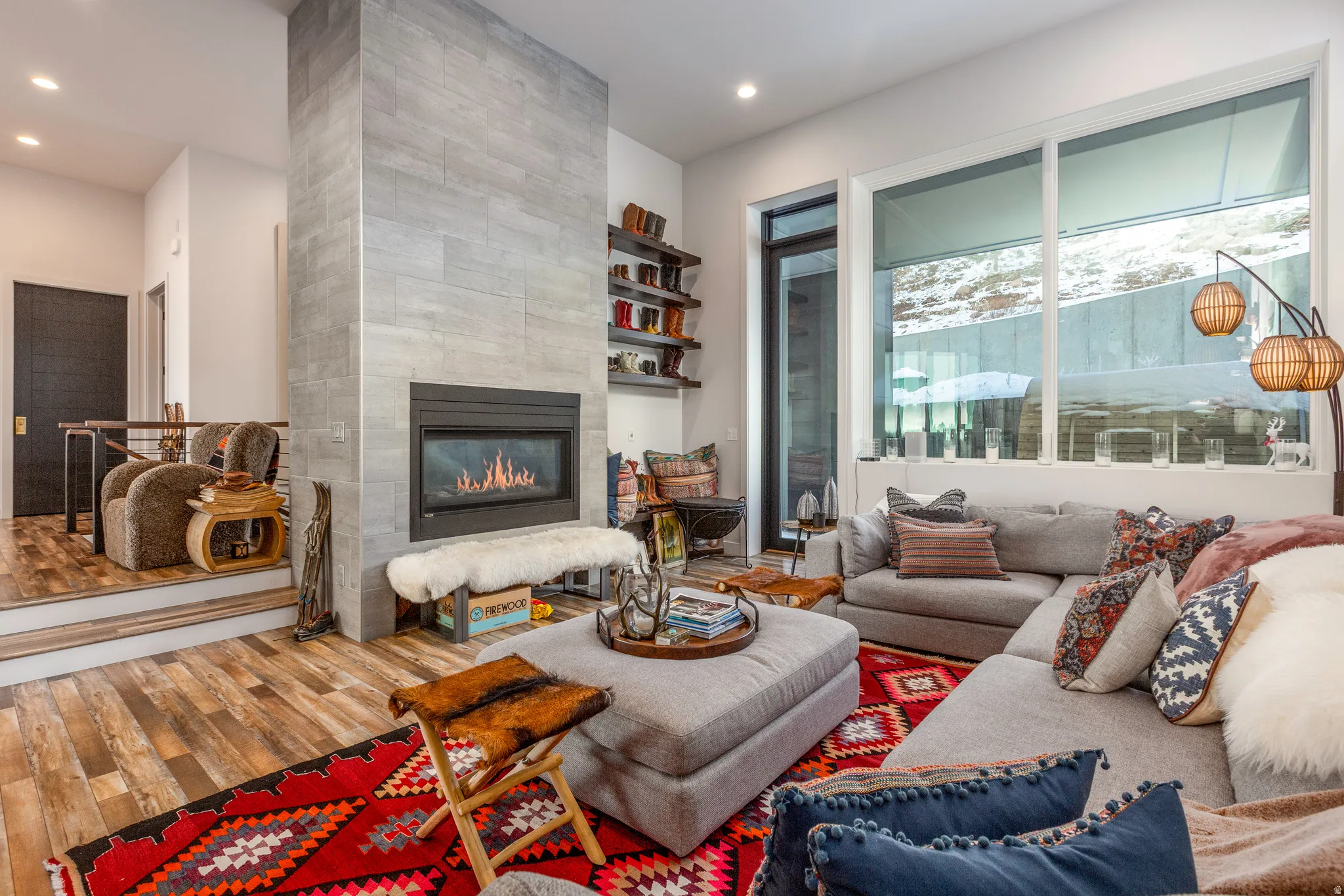 Living room featuring a tile fireplace, wood finished floors, and recessed lighting