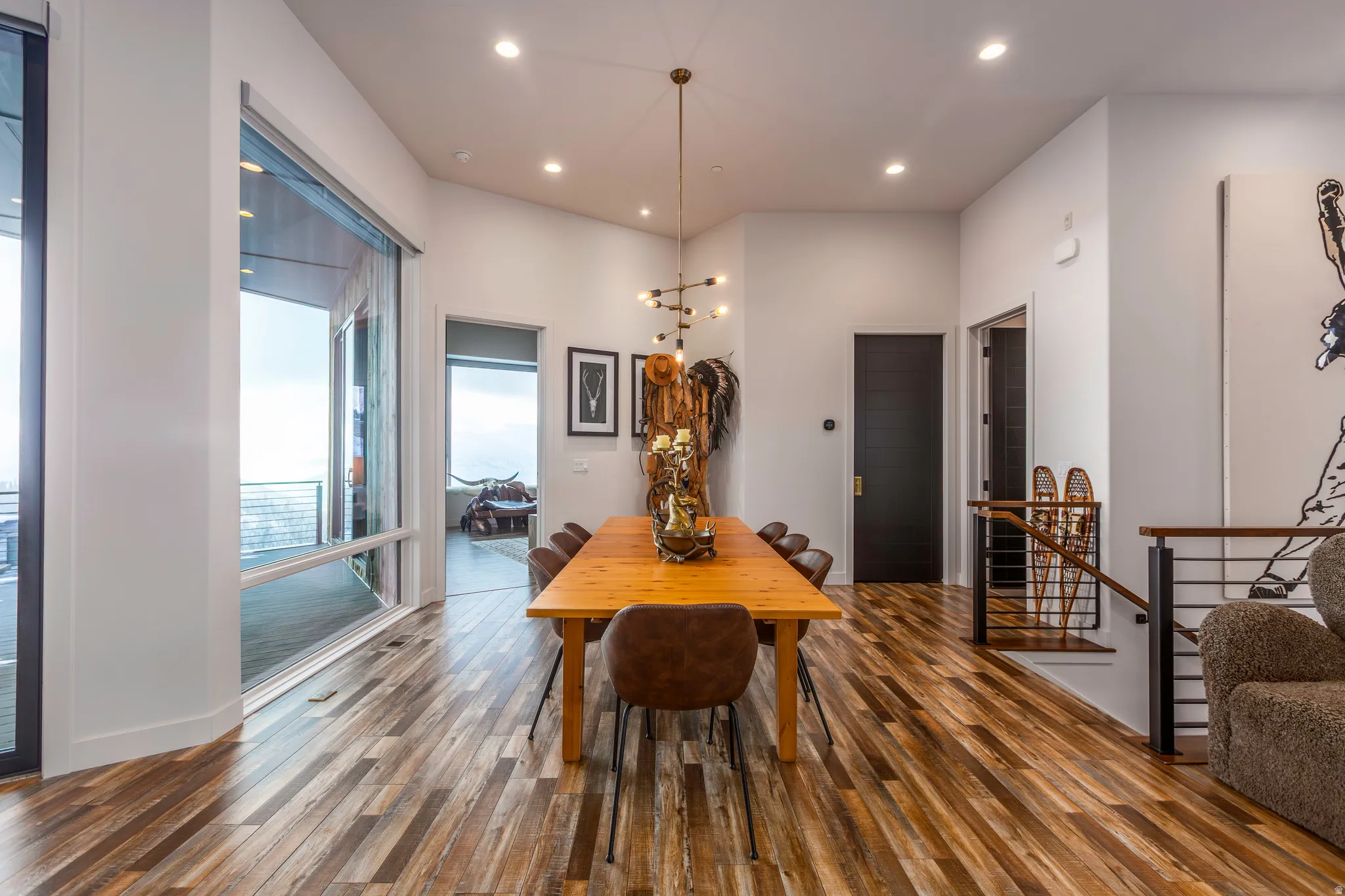Dining room featuring recessed lighting, wood-type flooring, and a chandelier