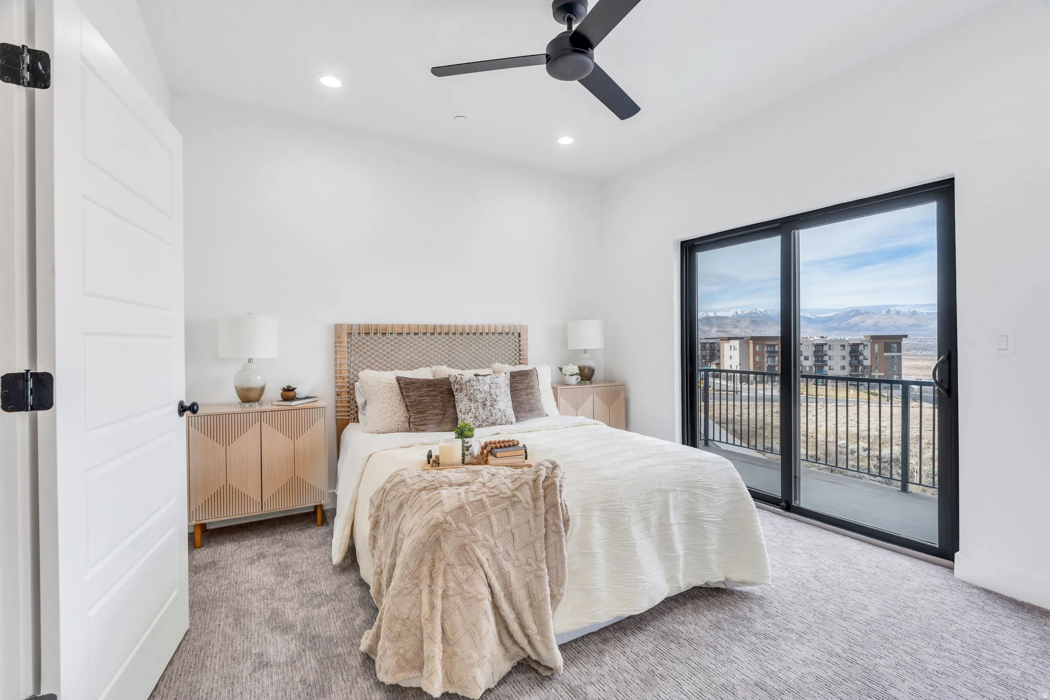 Carpeted bedroom featuring access to exterior, ceiling fan, and recessed lighting