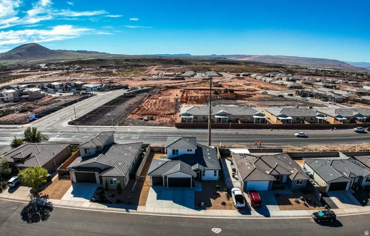 Aerial perspective of suburban area with a mountainous background