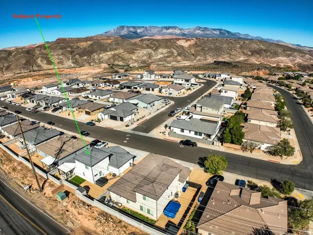 Aerial view of residential area with a mountainous background