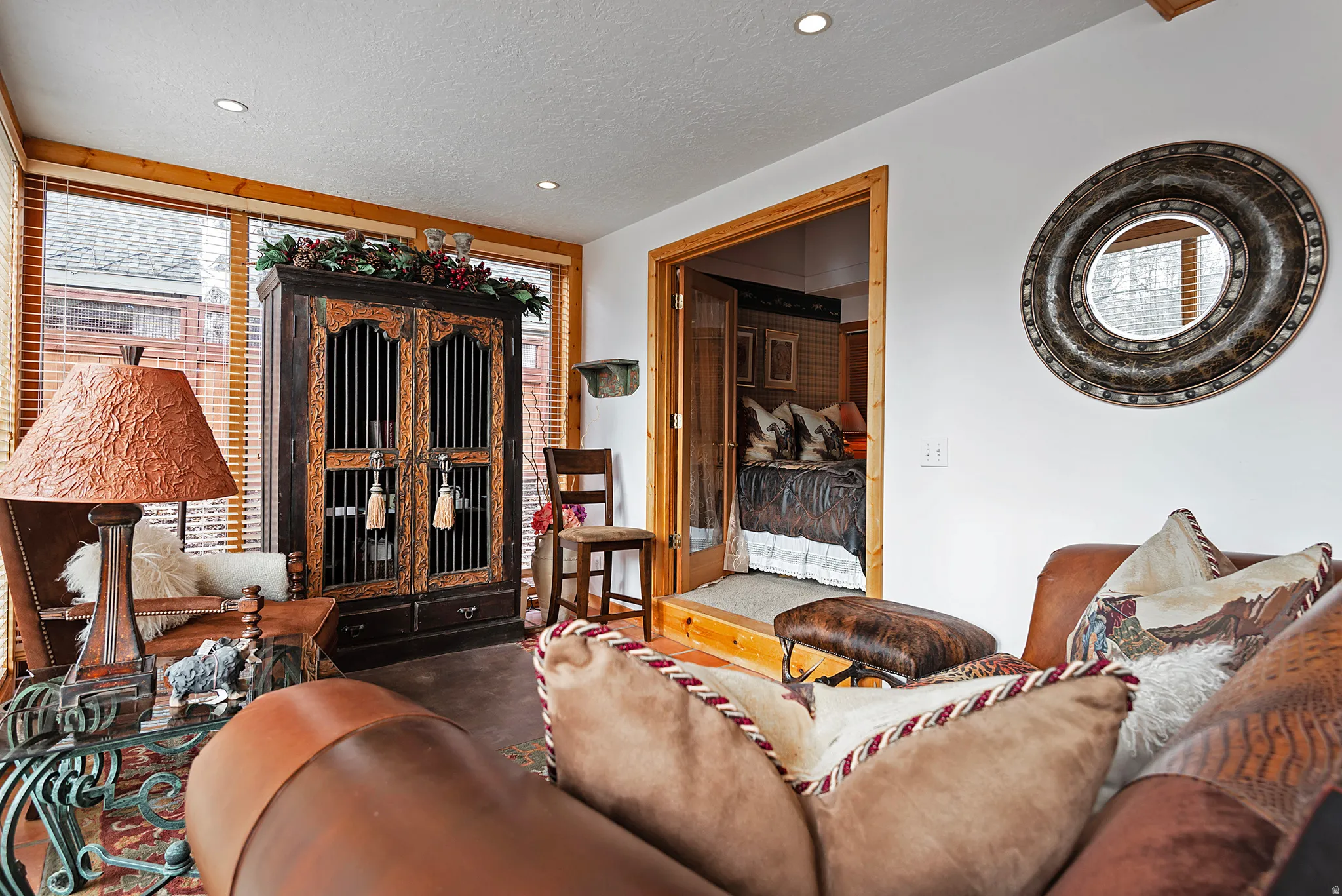 Living area with a textured ceiling and recessed lighting