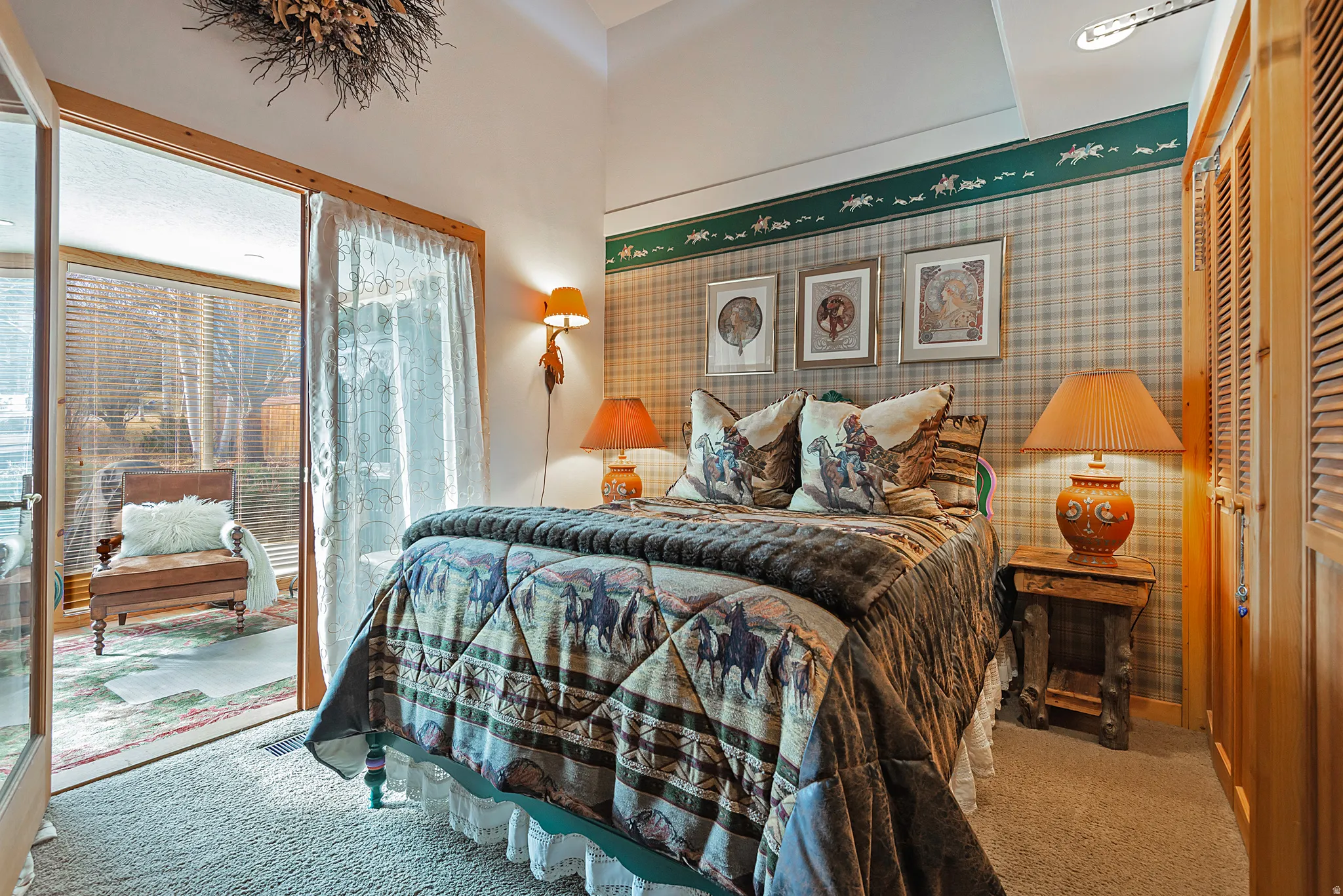 Bedroom featuring carpet, wallpapered walls, and access to outside
