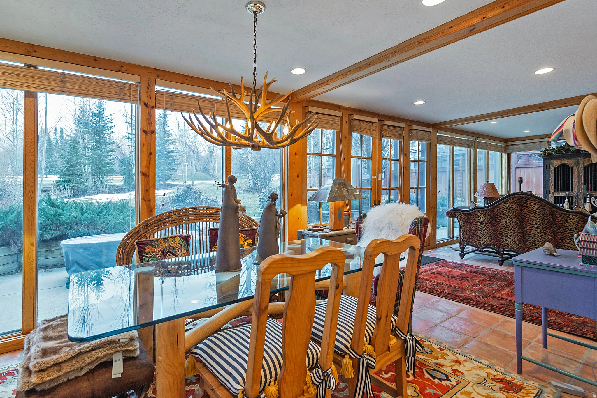 Dining room with healthy amount of natural light, a chandelier, and recessed lighting