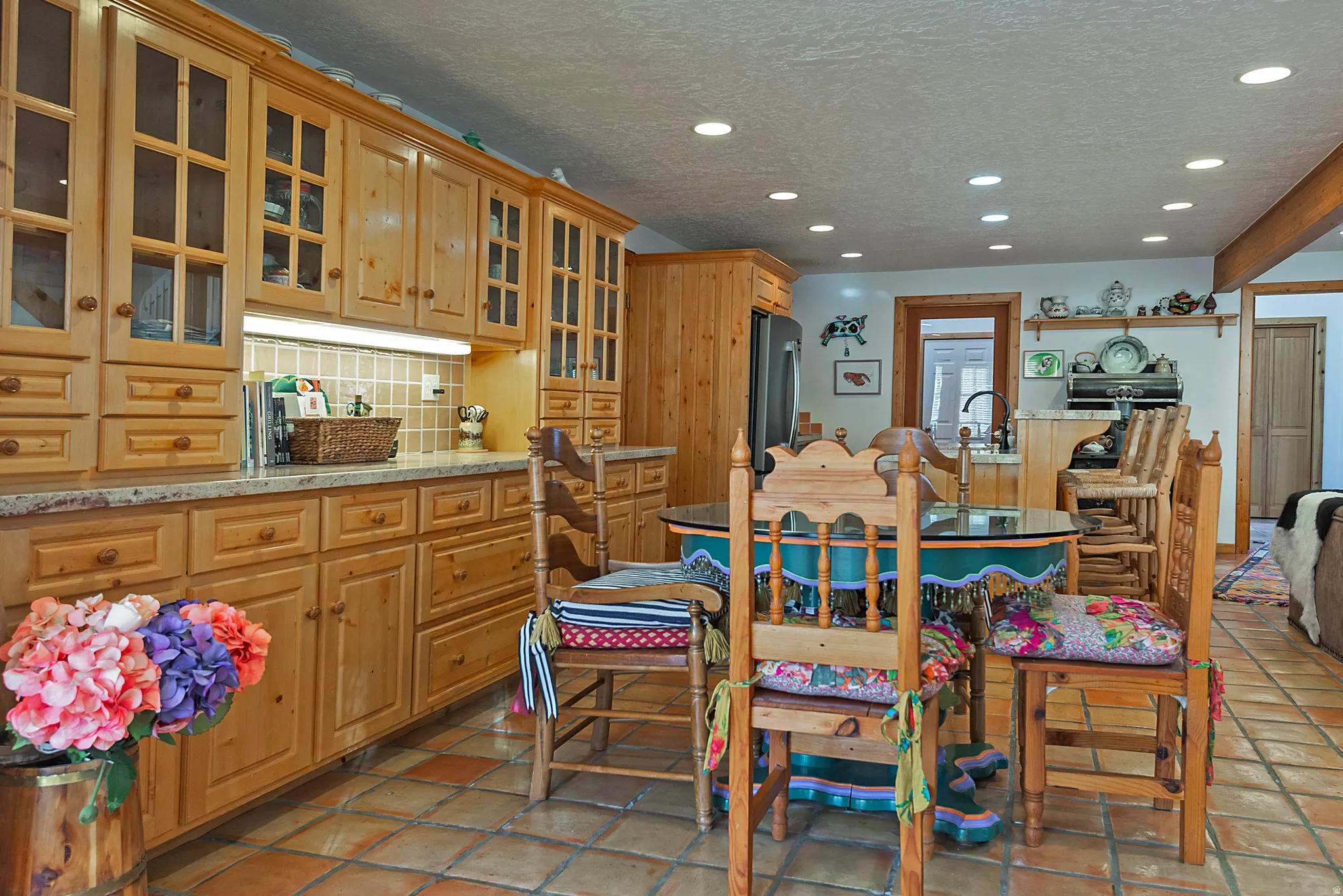 Dining room with recessed lighting, a textured ceiling, and light tile patterned flooring