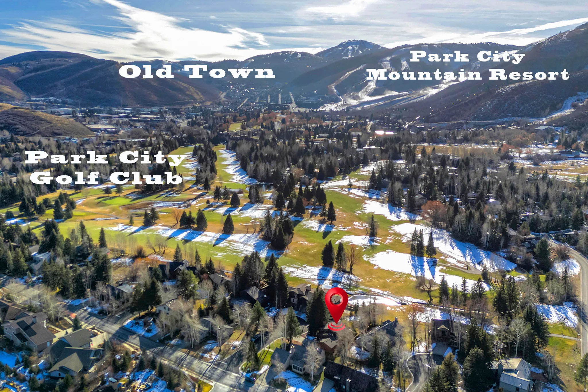 Aerial view of property and surrounding area with a mountain backdrop