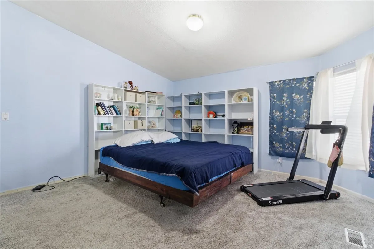 Bedroom with carpet and baseboards