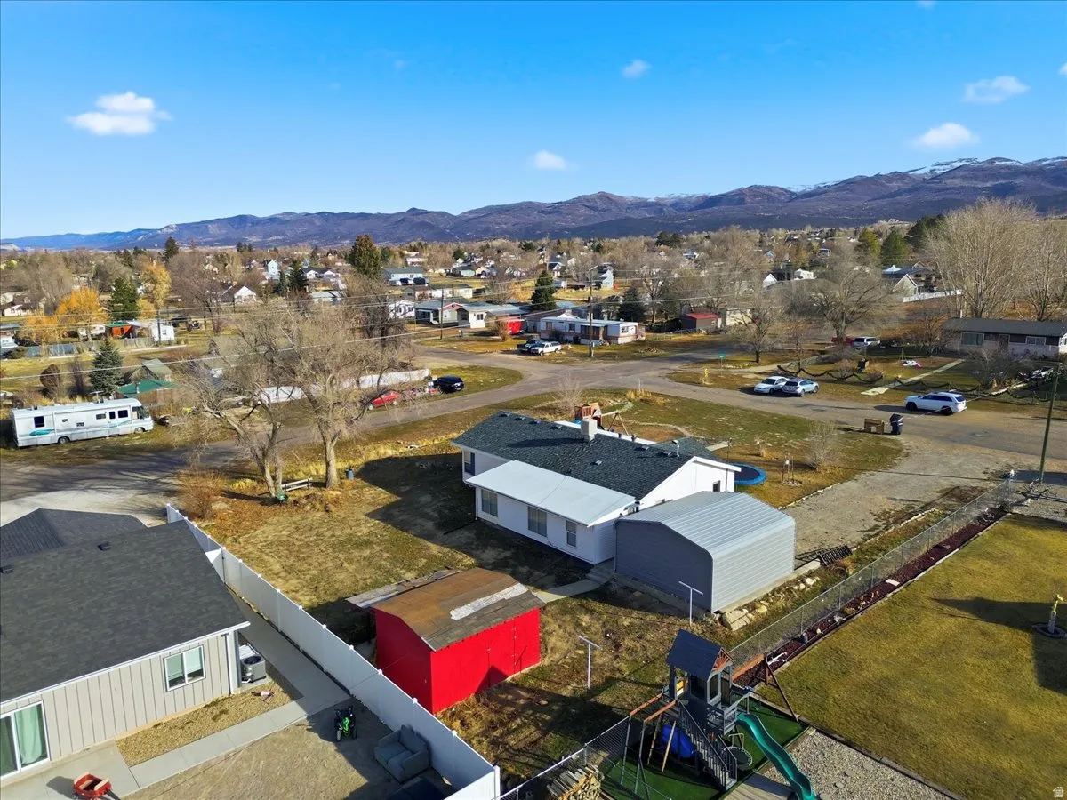 Aerial view of residential area featuring a mountain backdrop