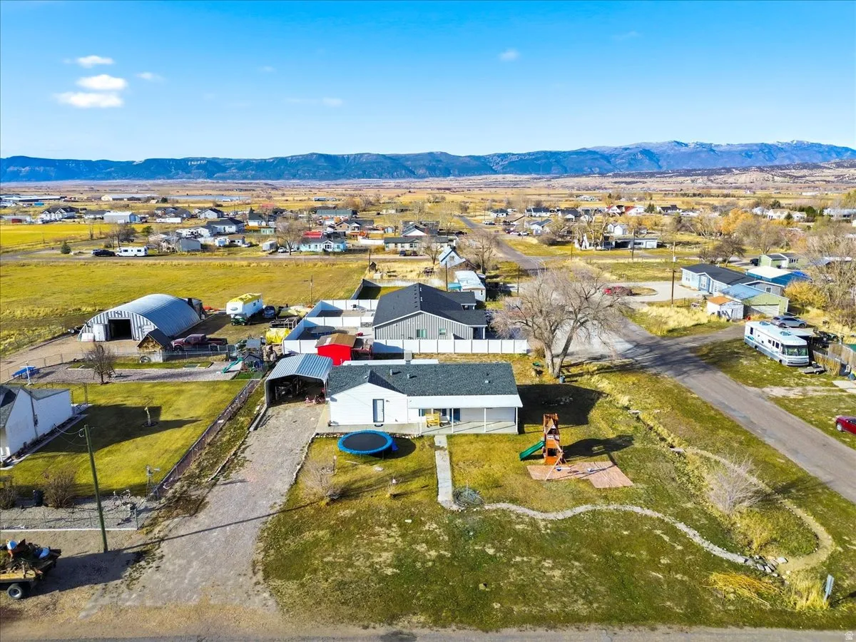 Aerial view of residential area with a mountainous background