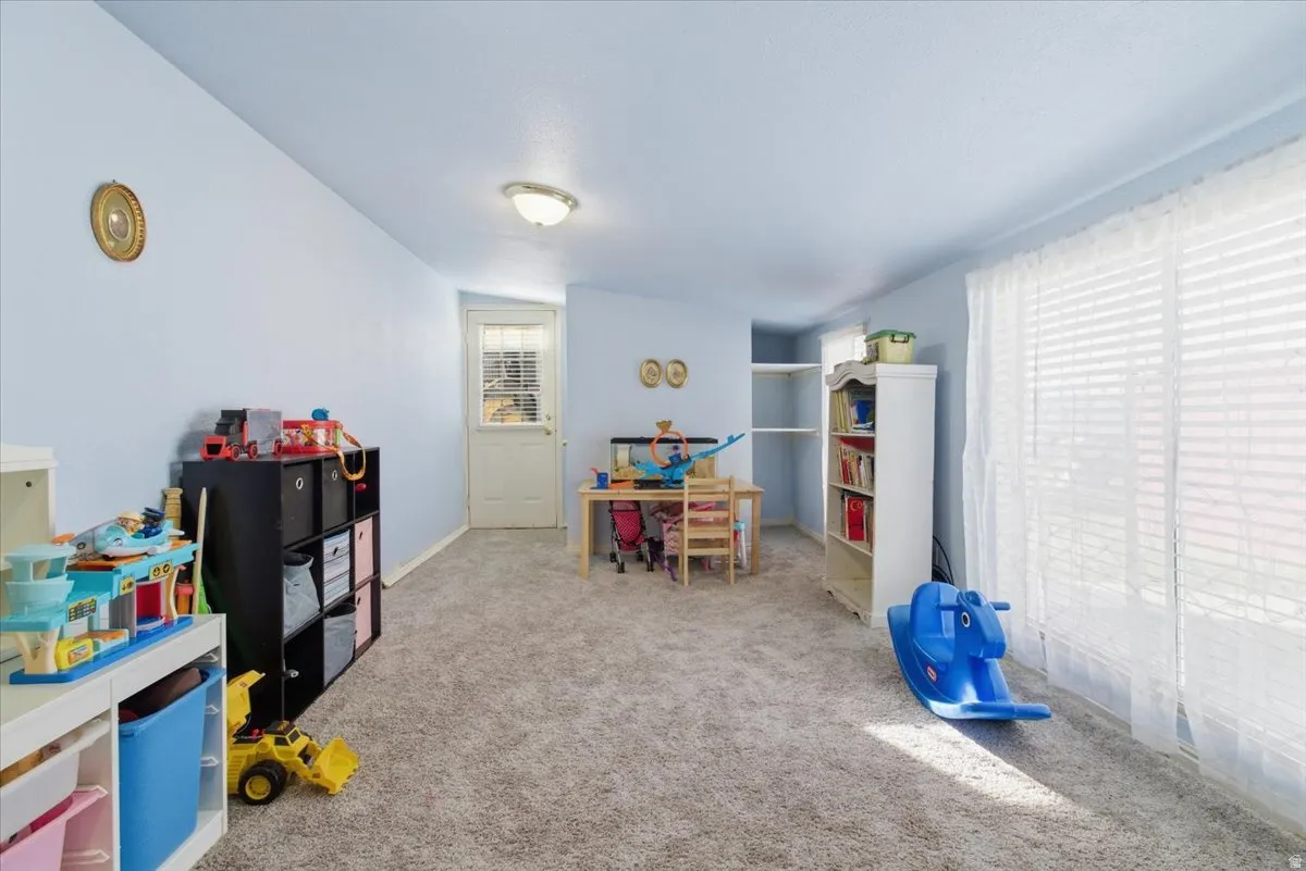 Playroom featuring carpet and baseboards