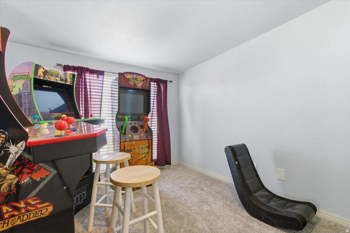 Office space featuring light colored carpet and baseboards