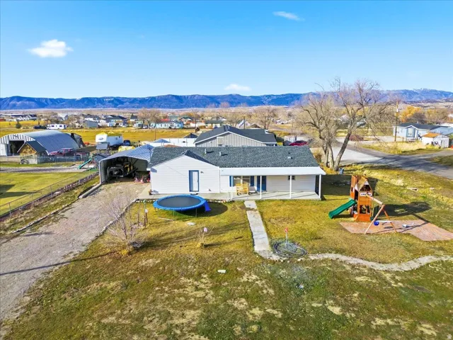 Aerial view of residential area featuring mountains