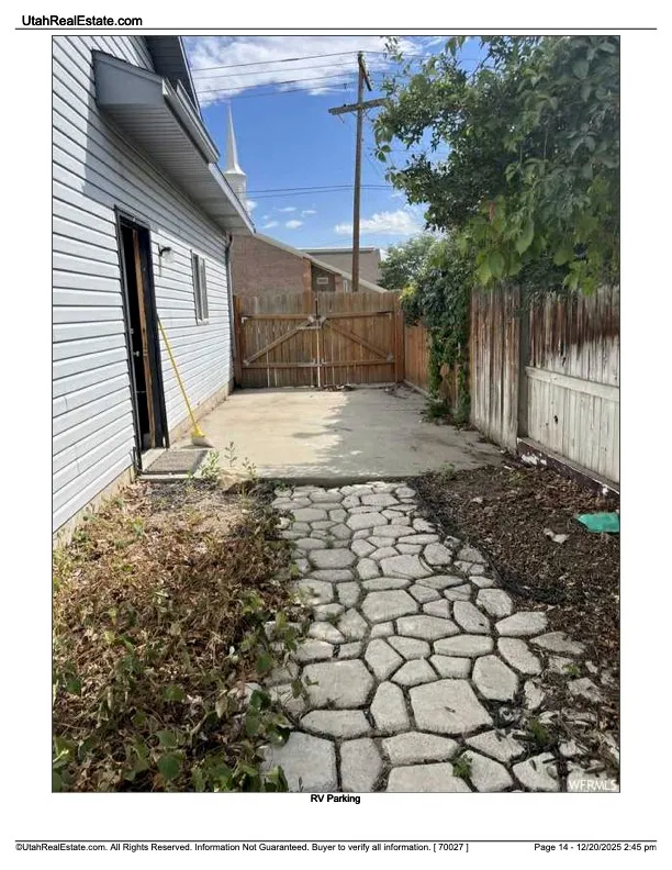View of patio with a gate