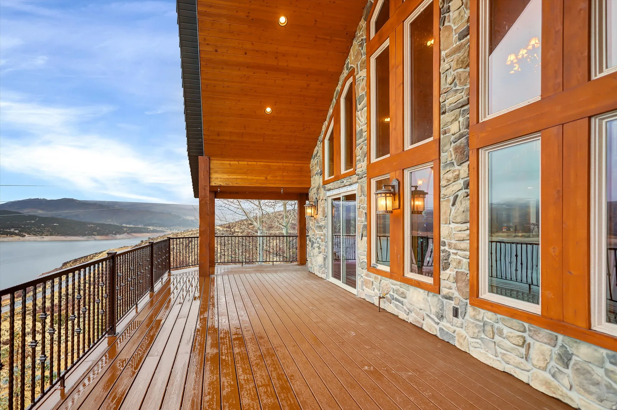 Deck with a water and mountain view