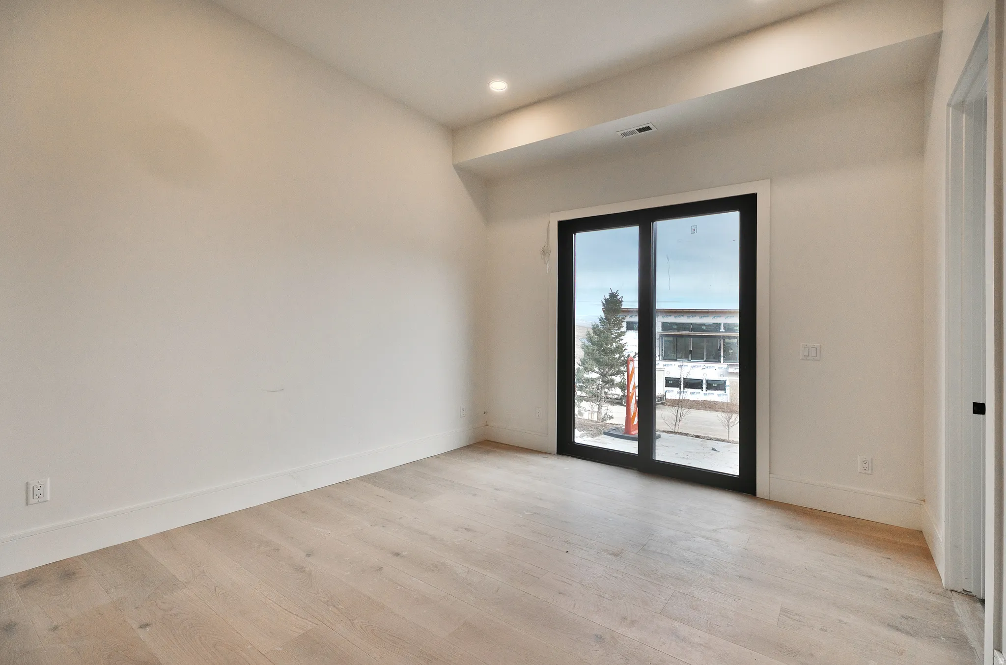 three bedrooms lower level featuring light wood-type flooring and recessed lighting, jack & jill bathrooms