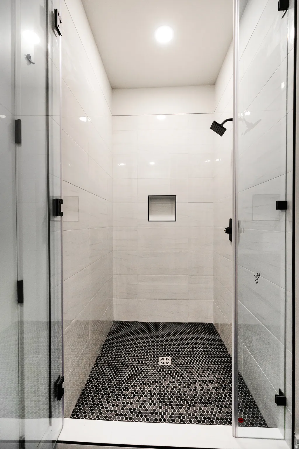 bathroom featuring a shower stall. Jack & Jill bathrooms on level 1