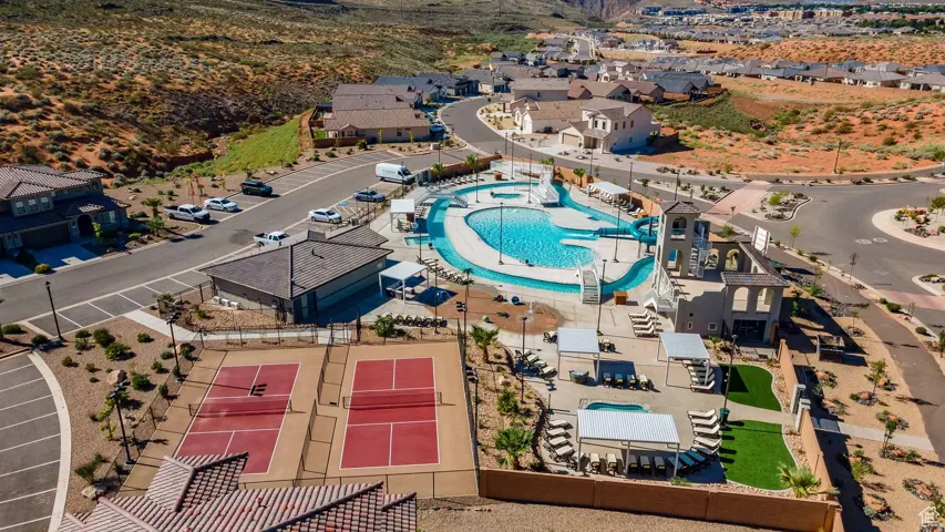Aerial perspective of suburban area featuring a pool