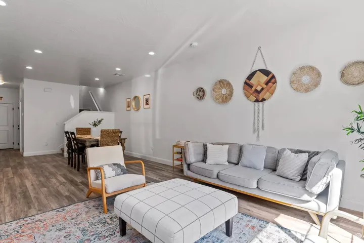 Living room with recessed lighting and wood finished floors