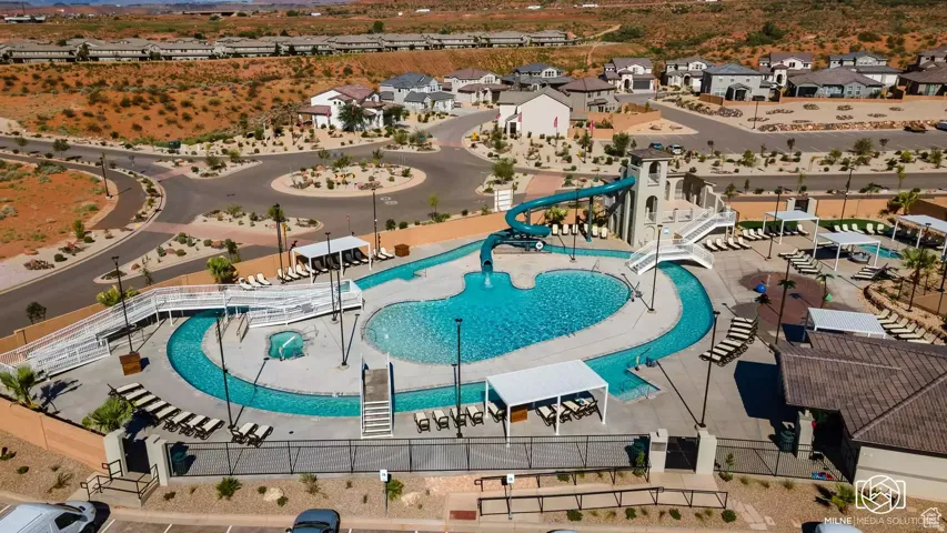 Aerial view of residential area featuring a pool
