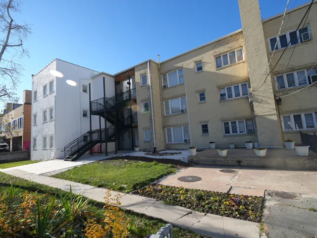View of apartment building / complex with stairway