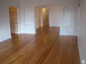 Apt # 7 > Spare room featuring dark wood finished floors
