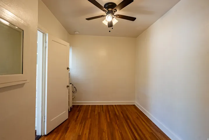 Hardwood flooring paired with white baseboards