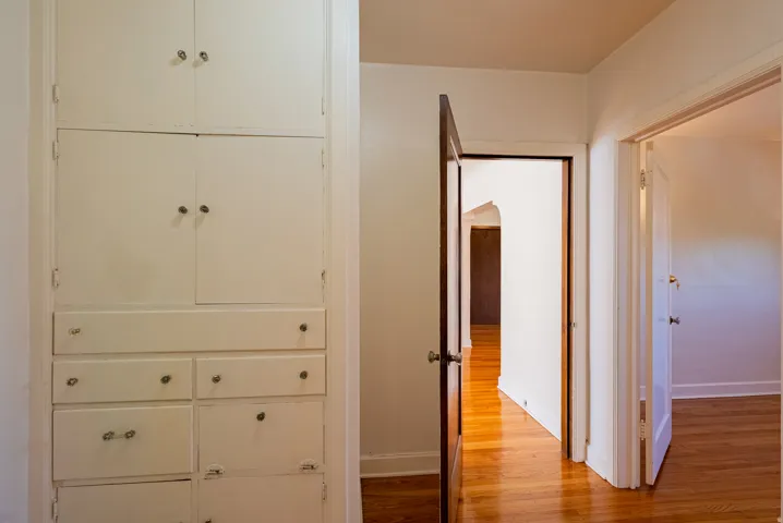 Built-in cabinetry with multiple drawers and upper storage
