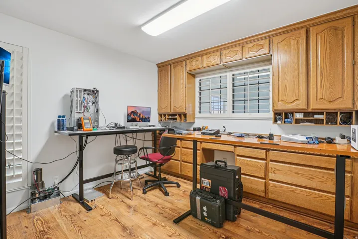 Office with light wood finished floors and baseboards