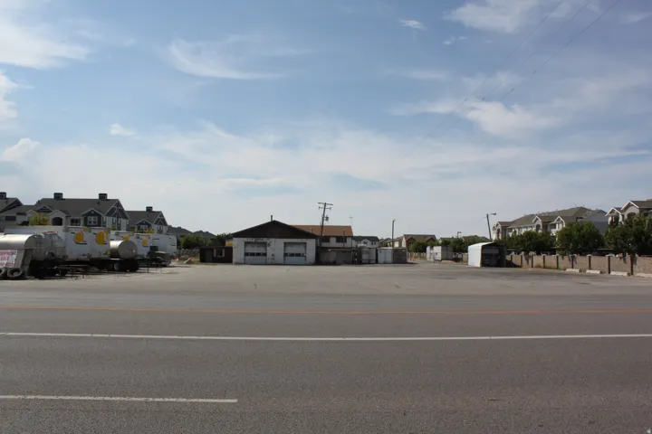 View of asphalt street featuring a residential view