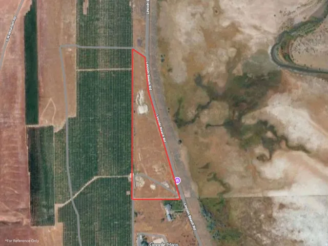 Aerial map of property and surrounding area featuring property parcel outlined