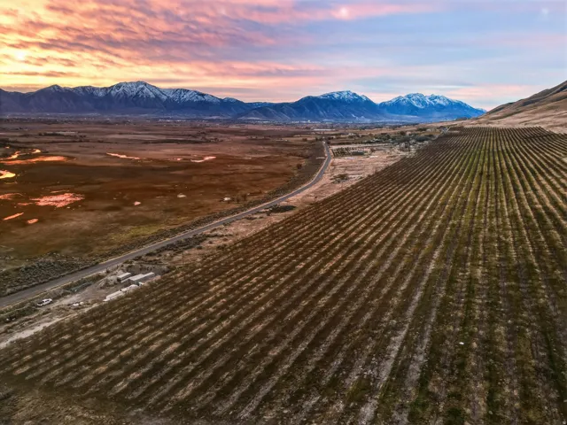 Aerial view of sparsely populated area with mountains and farmland