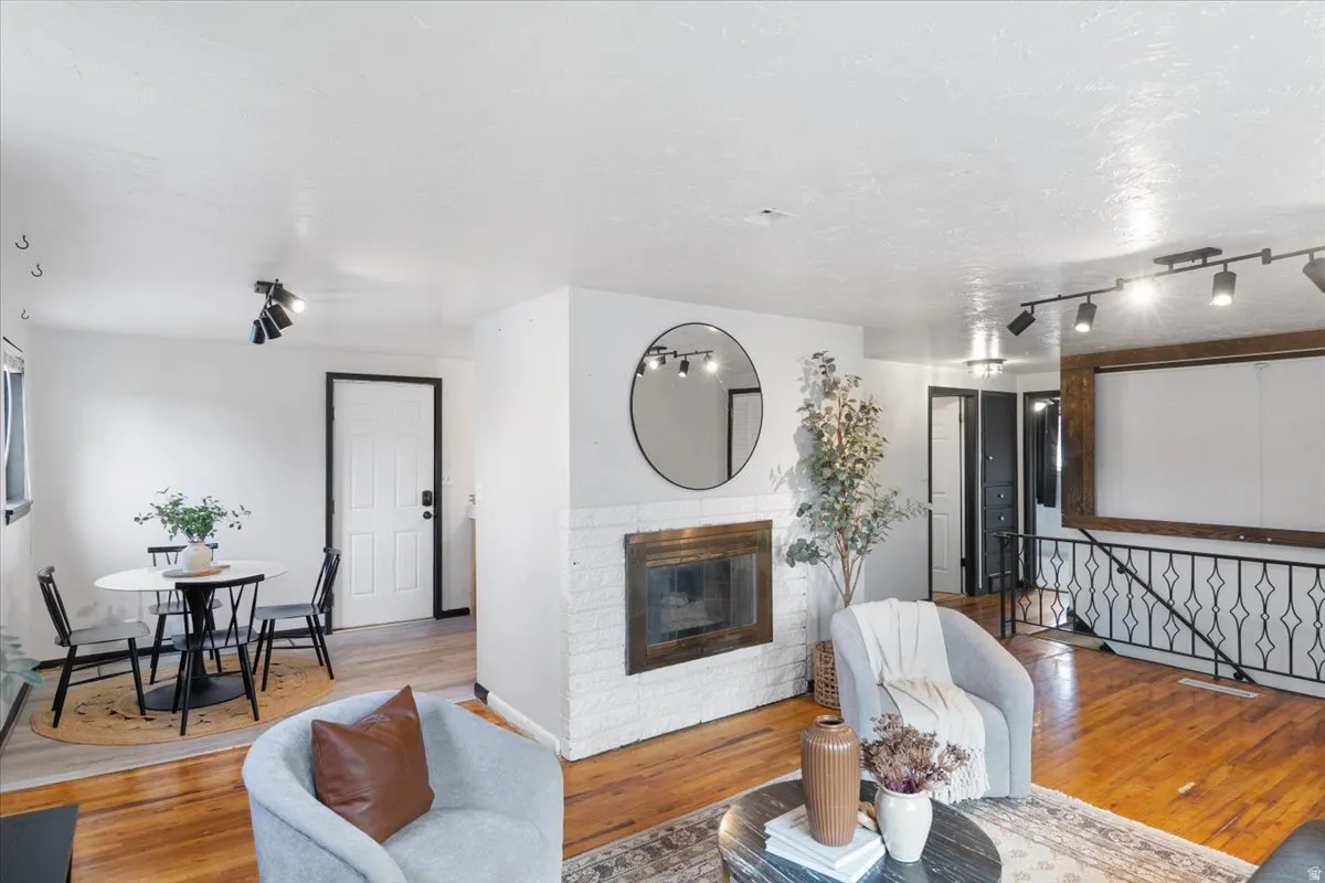 Beautiful living room with a view of the dining area and stairs