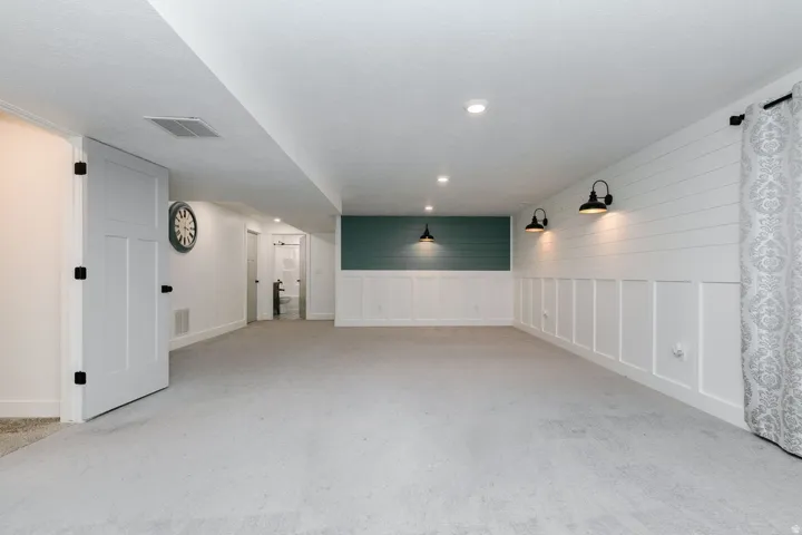 Carpeted family room featuring recessed lighting and baseboards