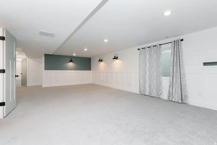 Family room featuring light colored carpet