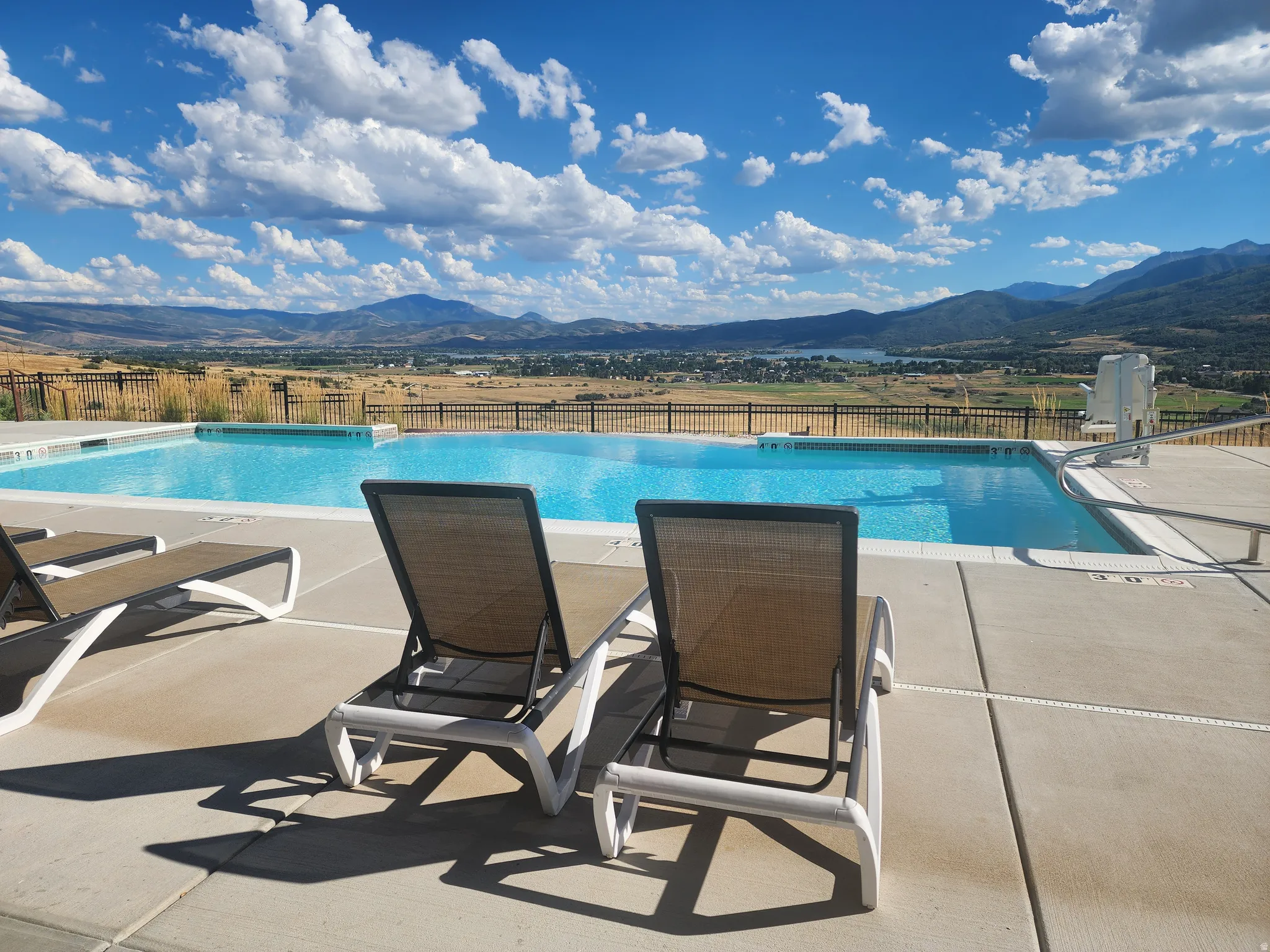 View of swimming pool featuring a mountain view and a patio