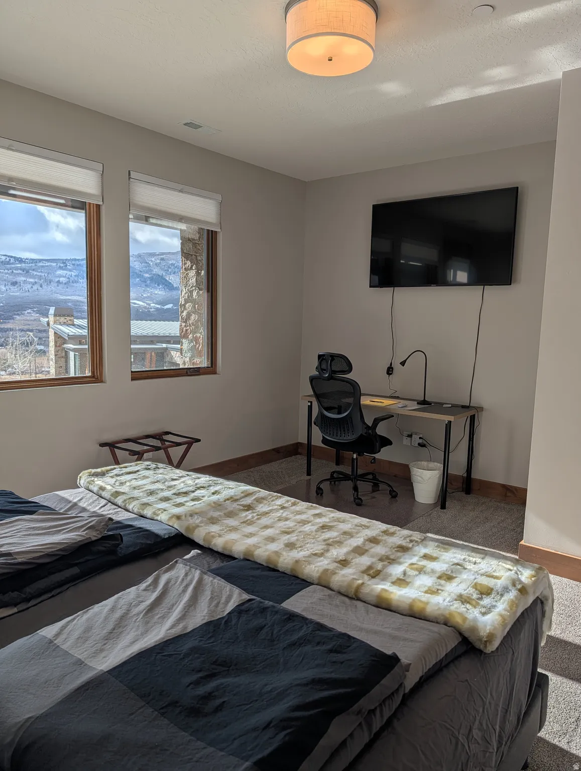Bedroom with a desk and baseboards