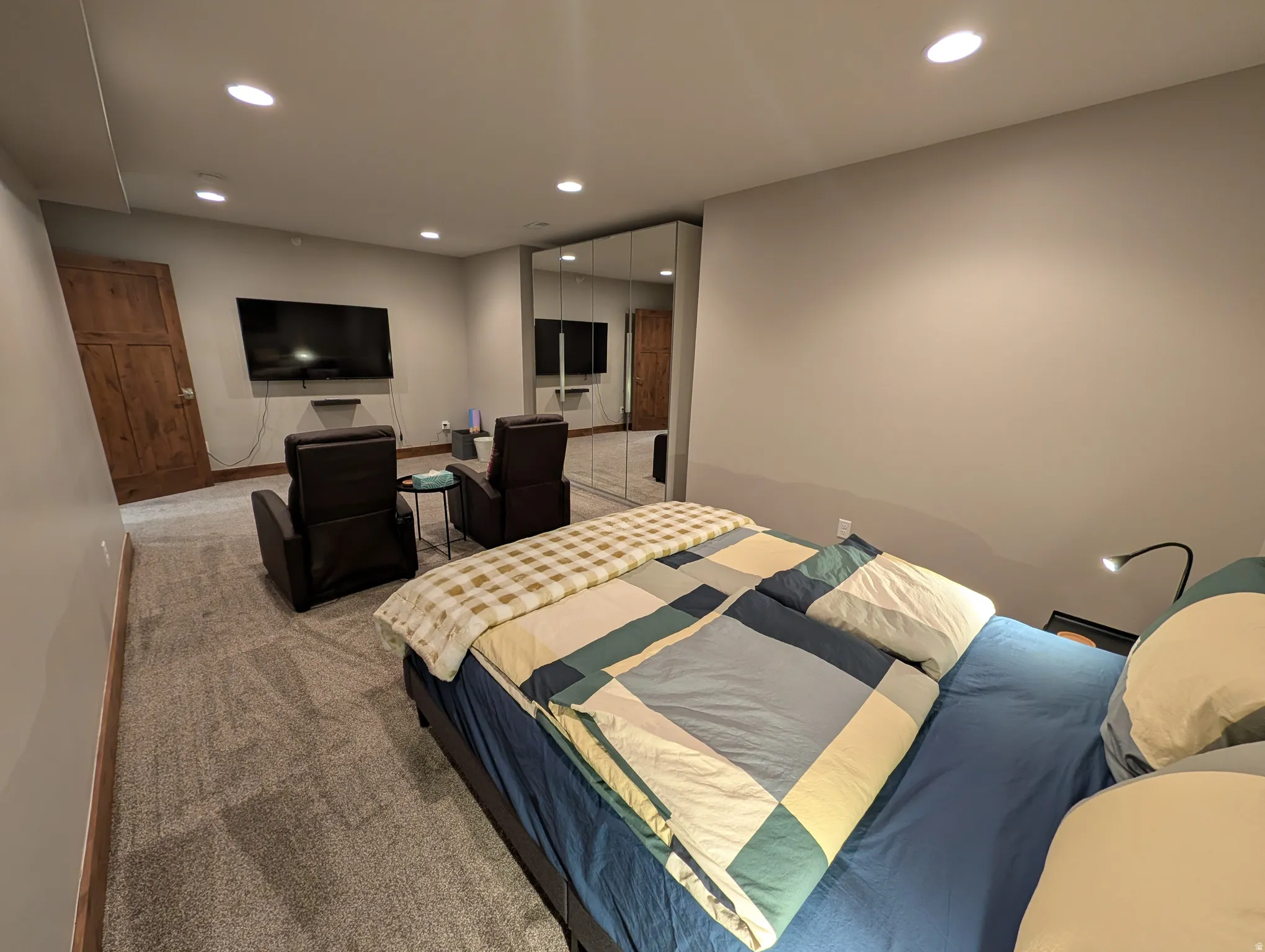 Carpeted bedroom with recessed lighting