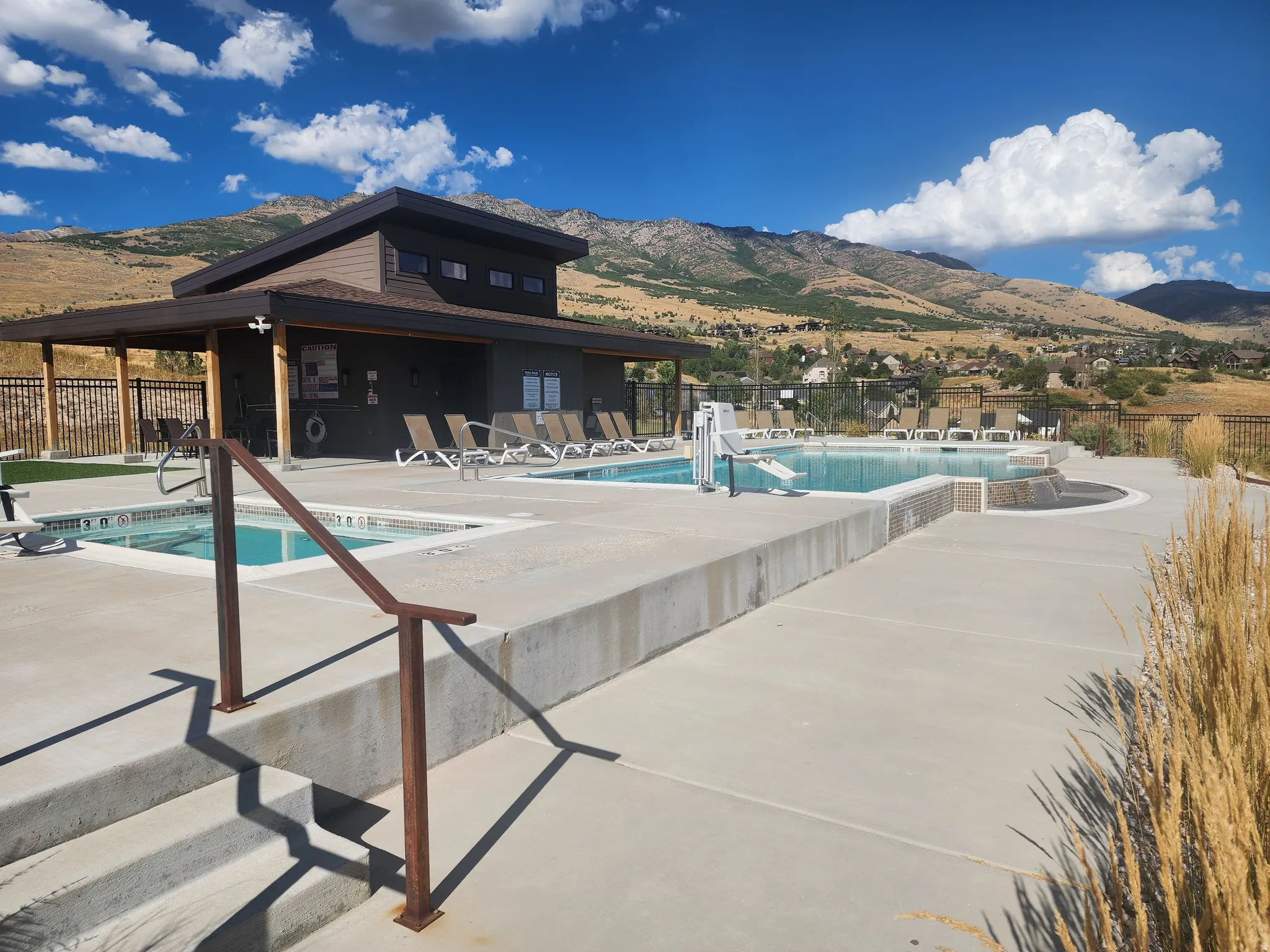 Community pool featuring a patio area and a mountain view