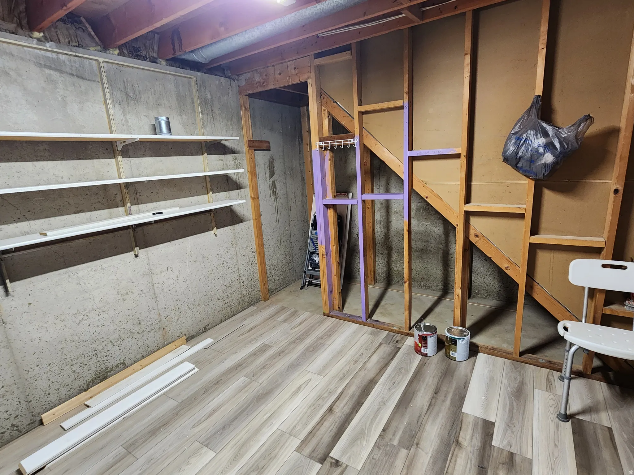 Unfinished basement with wood finished floors