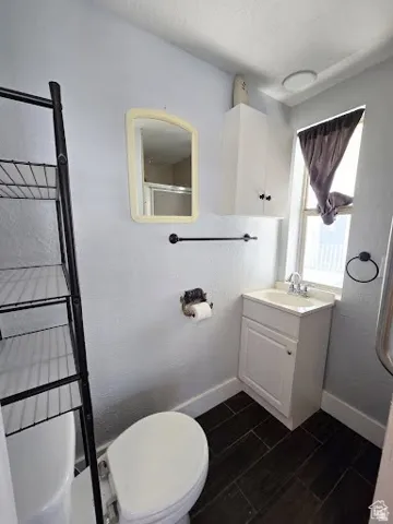 Bathroom with vanity and a shower with door